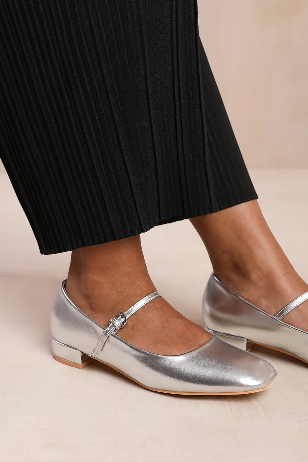 MINSK LOW HEEL WITH STRAP AND BUCKLE DETAIL IN SILVER FAUX LEATHER